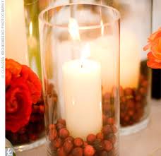 candle, cranberries, deep red roses - theknot.com