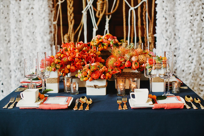 Stick with a cotton linen in a classic color such as navy, with the pop of color in the napkin. http://www.milouandolin.com/wp-content/uploads/2012/06/san-francisco-wedding-photographer-0004.jpg